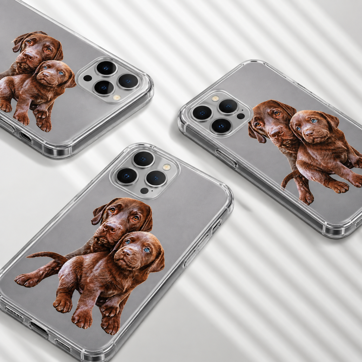 Three personalized phone cases with images of brown Labrador puppies. Clear material.