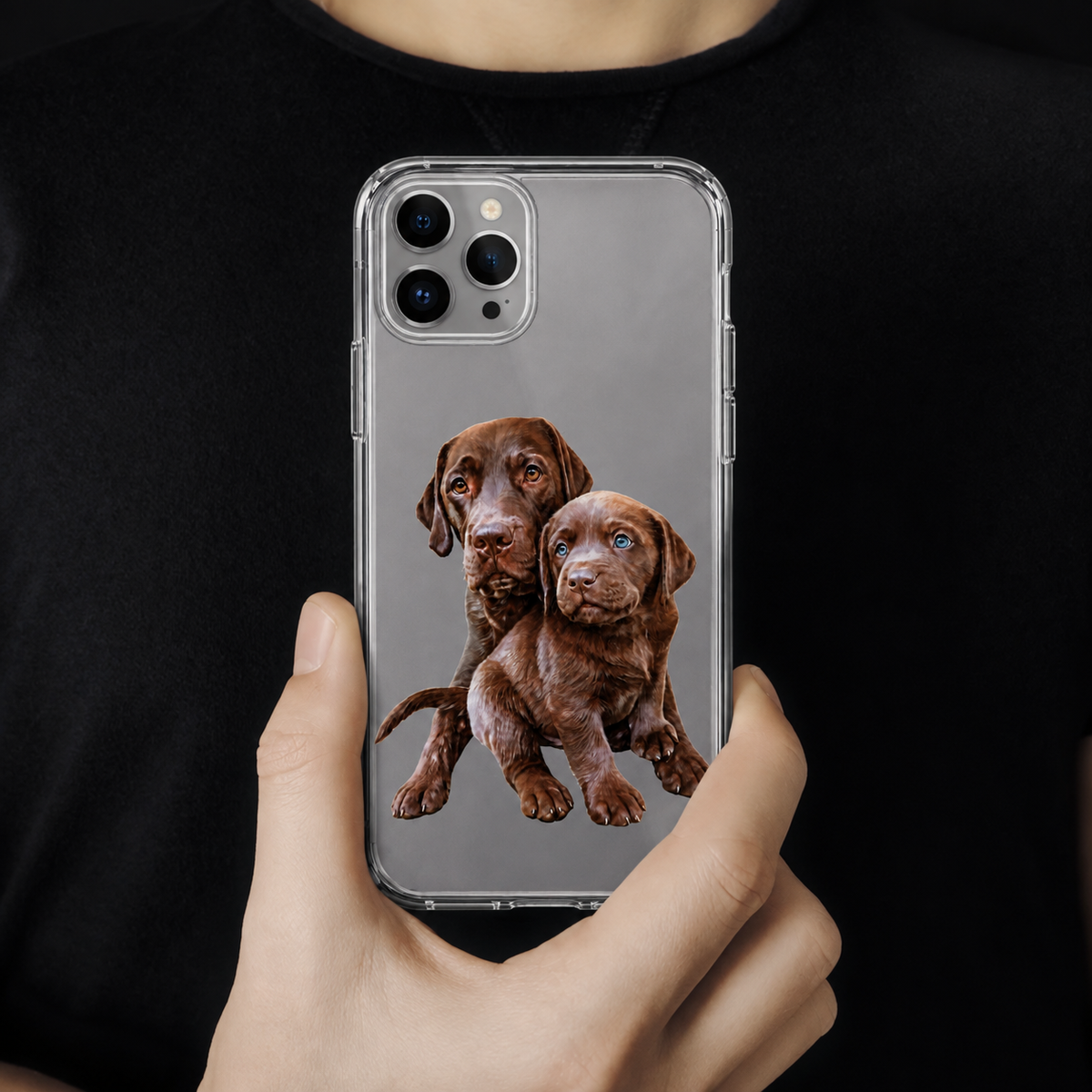 Clear phone case with a graphic of two brown puppies.