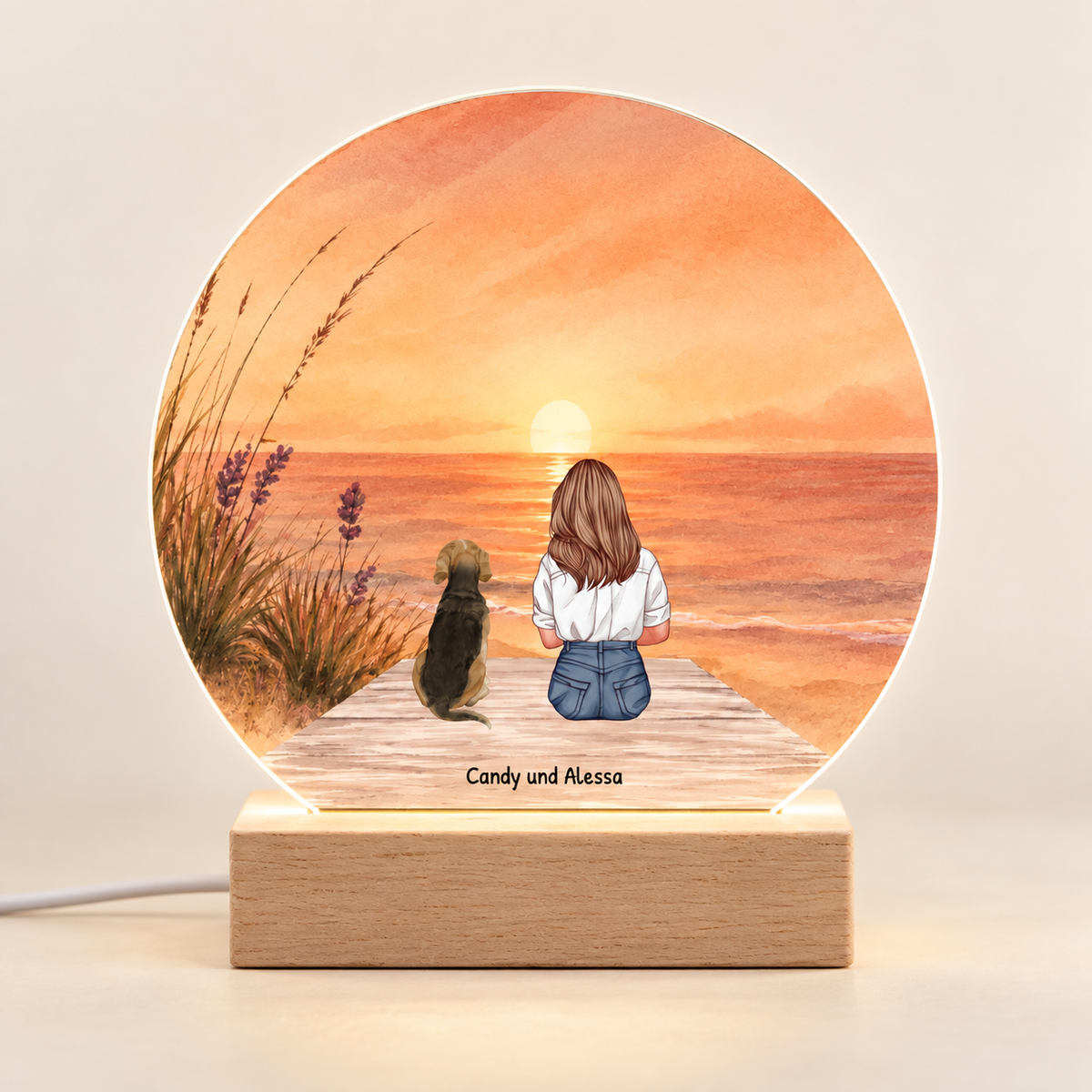 Personalized LED night light with colourful sunset, wooden base, motif of a woman and dog.