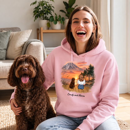 Personalized pink hoodie with an illustration of a person and a dog in nature.