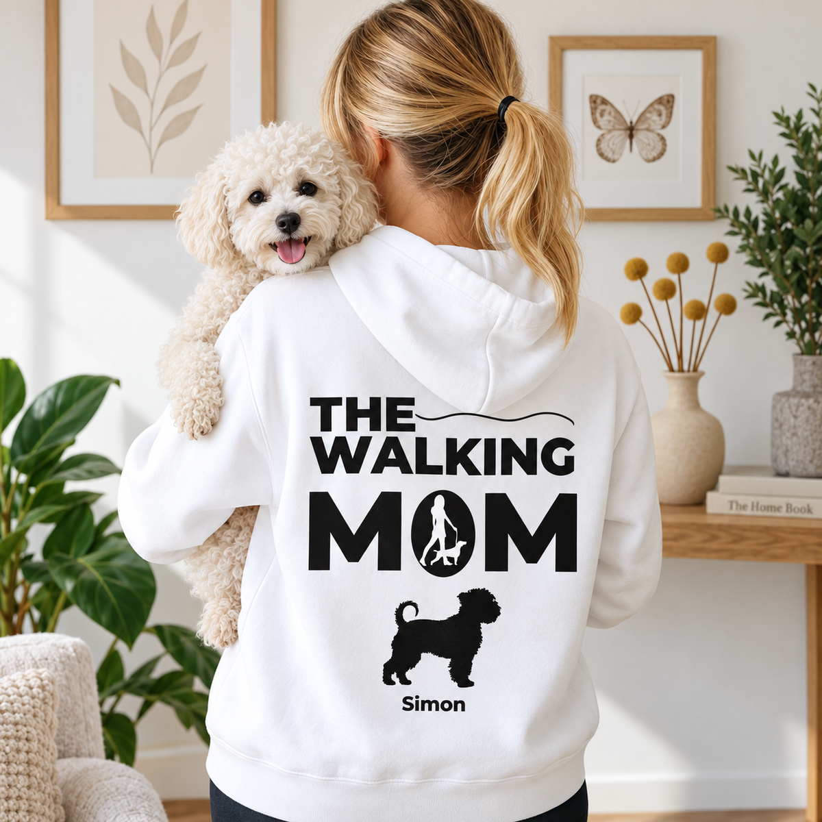 Personalized white hoodie with black printed text "THE WALKING MOM" and dog figure.