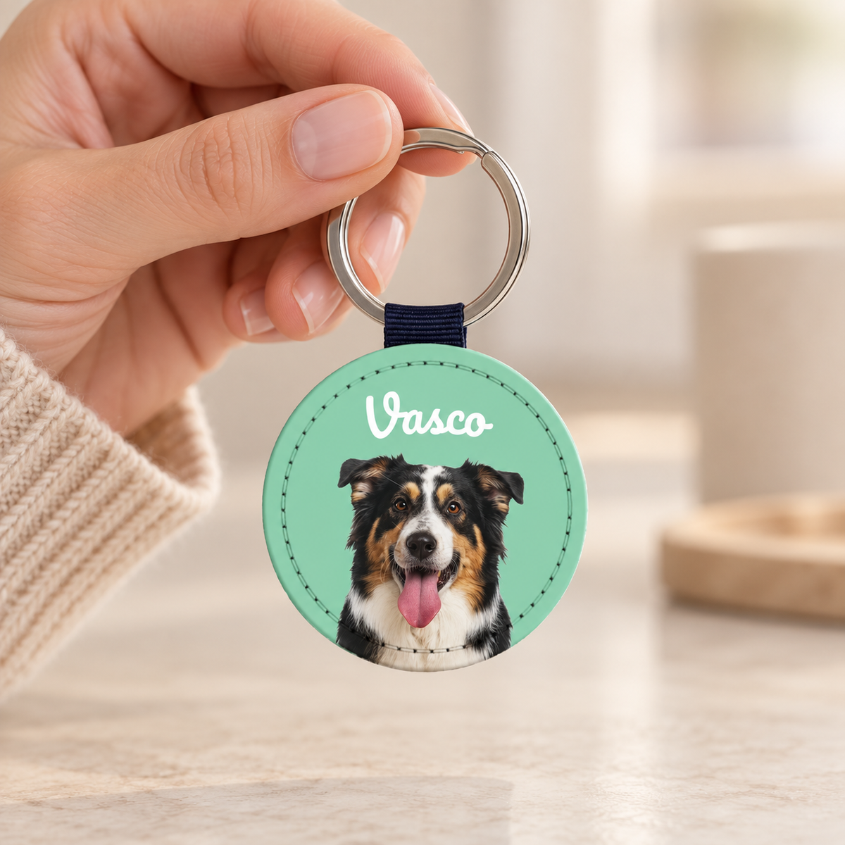 Personalized faux leather keychain with dog portrait and blue strap.