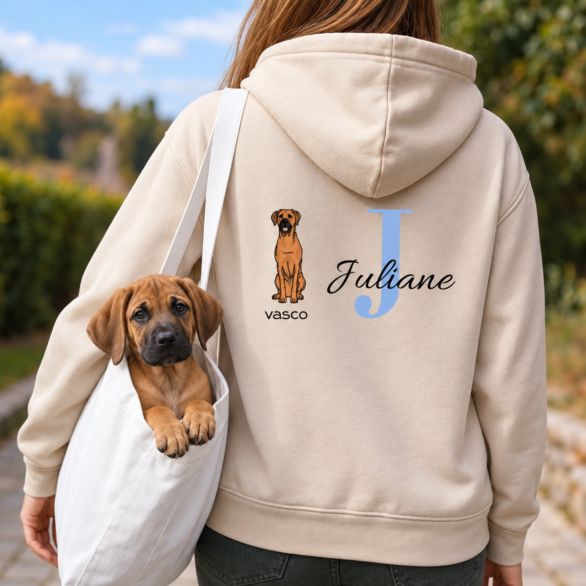 Beige hoodie with personalized initial "J" and dog motif, ideal for animal lovers.