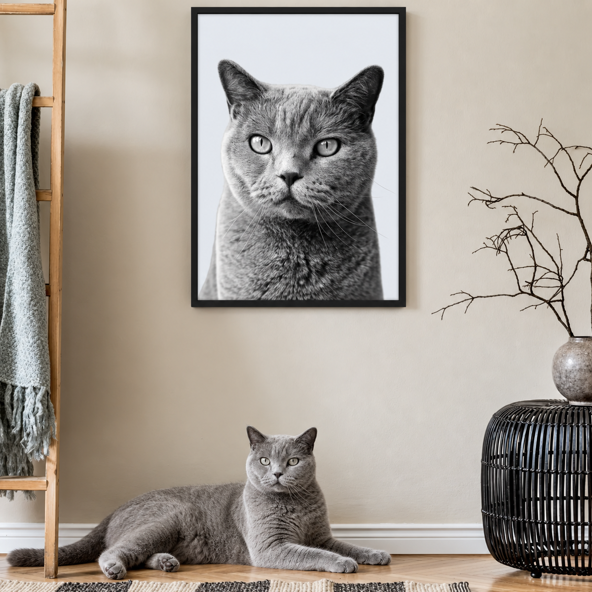 Framed grey pet portrait, a grey cat lying on the floor next to it. Minimalist interior.