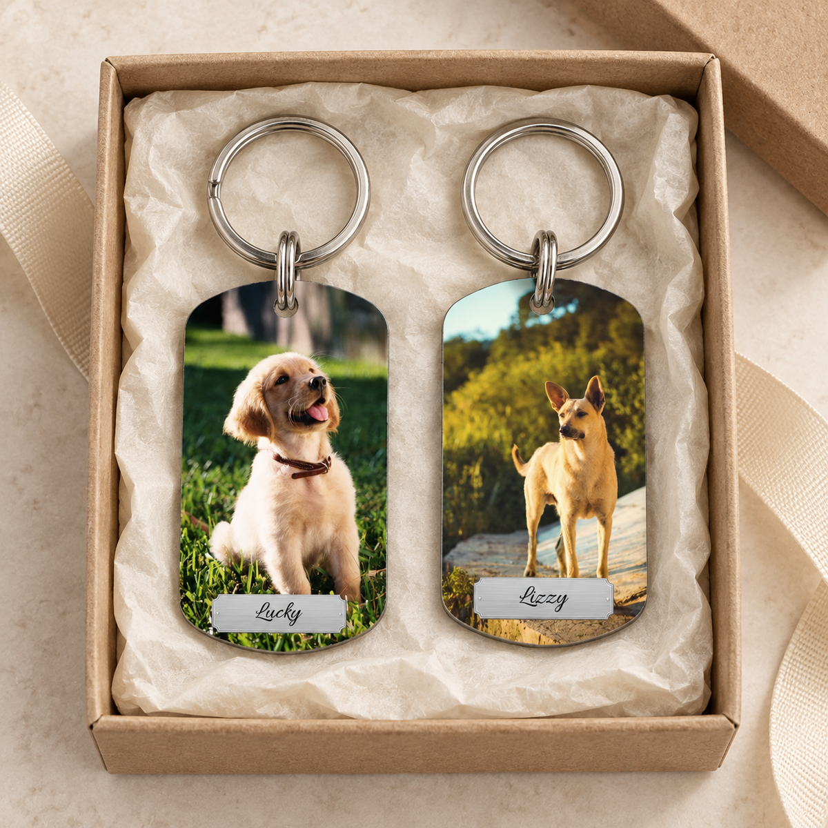 Personalized keychain with two photos of dogs in gift packaging.