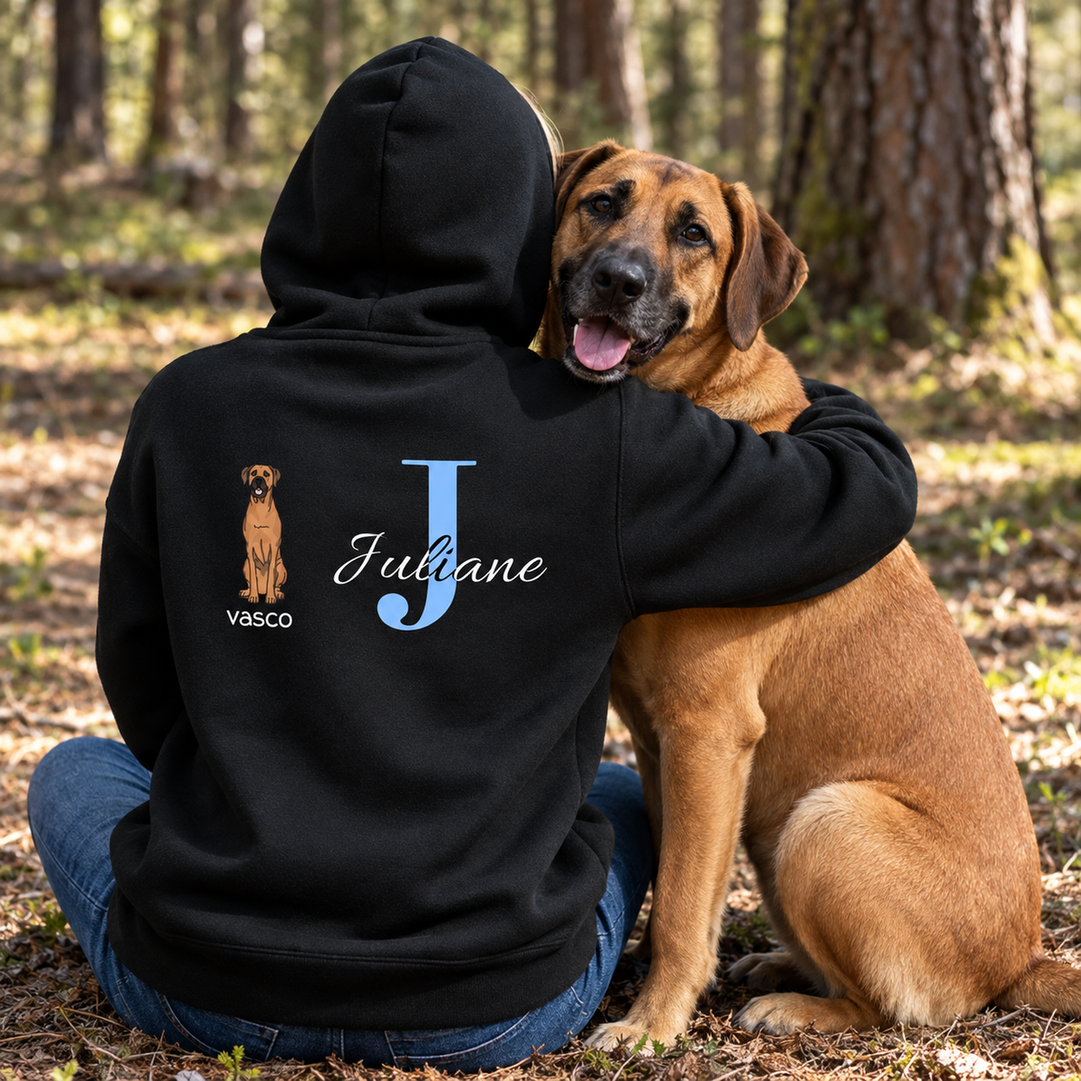 Black hoodie with blue initial "J", dog picture and the name "Vasco" on the back.