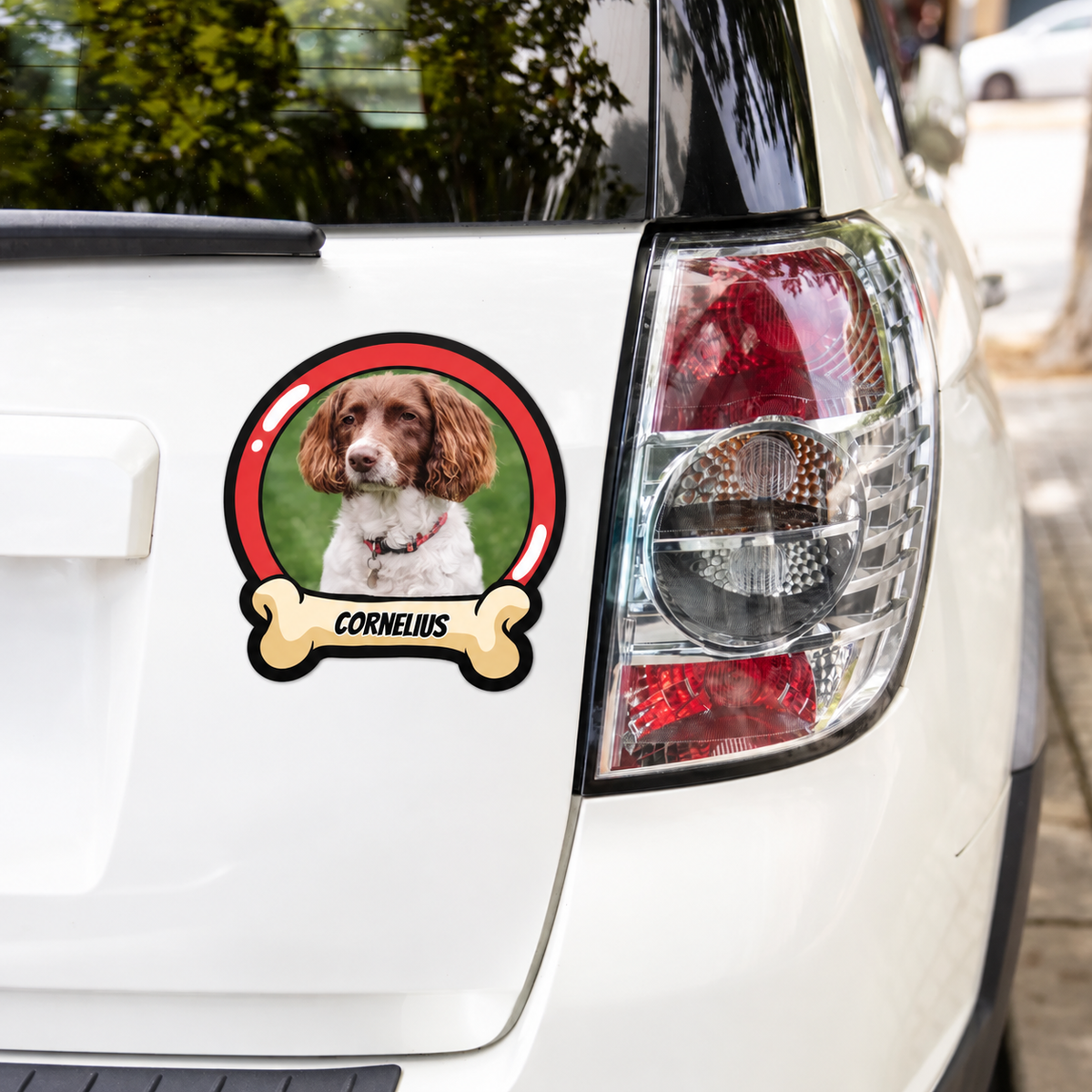 Personalized car sticker with dog picture and the name "CORNELIUS" on a white background.