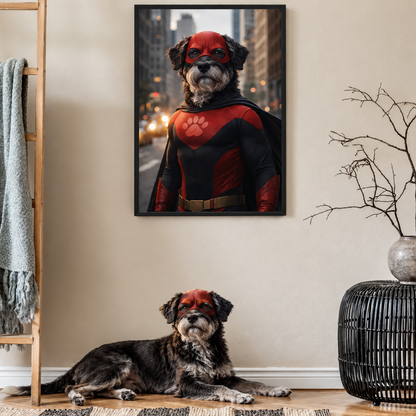 Dog in a superhero costume, red suit with mask, framed poster in the background.