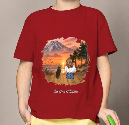 Red kids' T-shirt with a personalized print of a person and dog in a landscape scene.