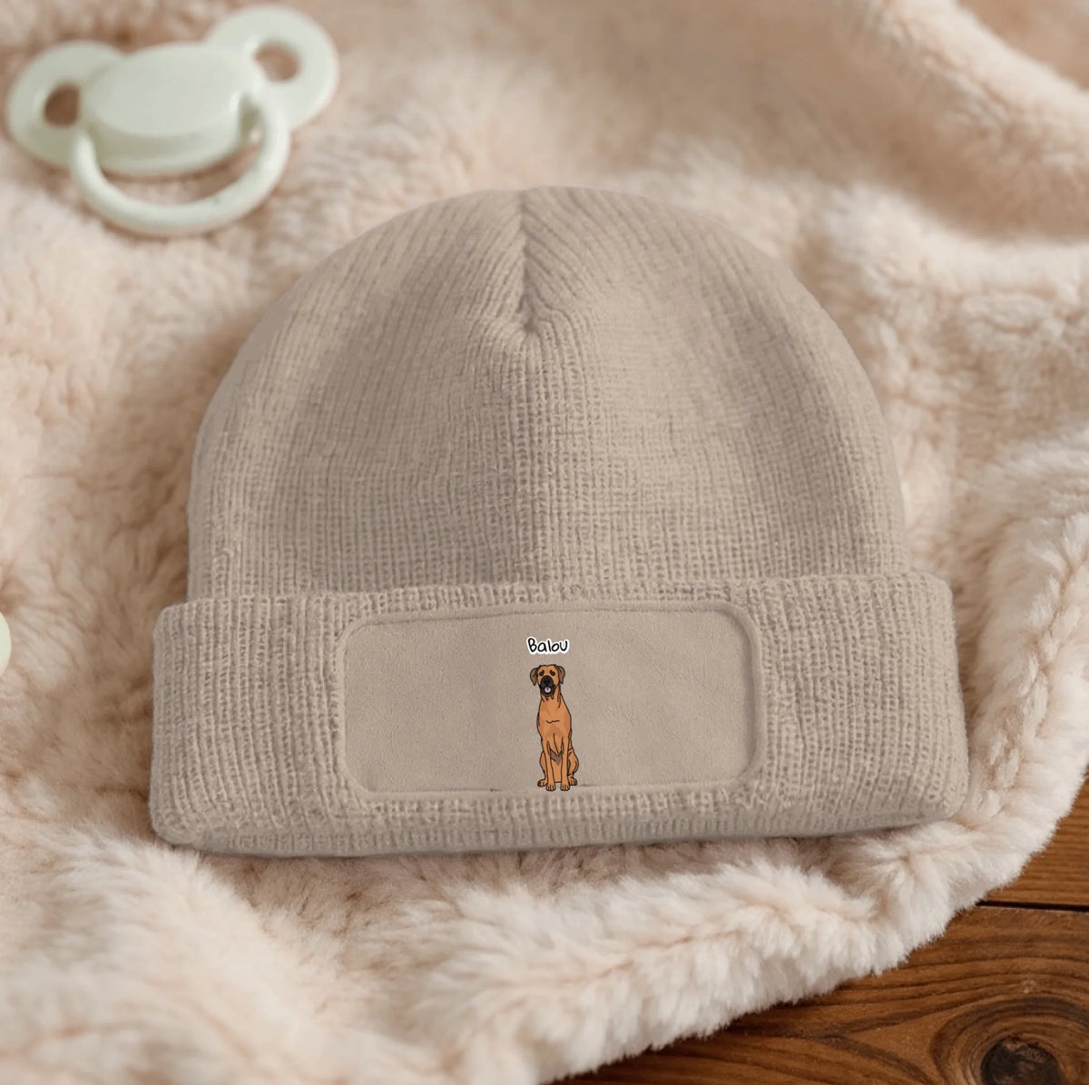 Beige personalized beanie with embroidered dog design on the front.