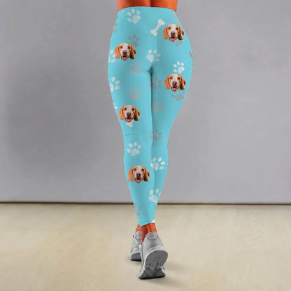 Personalized blue leggings with dog and paw motifs, stretchy material.