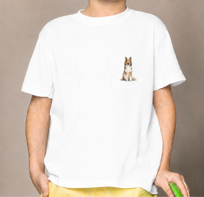 White kids' T-shirt with heartbeat line and dog motif, personalized with a name.