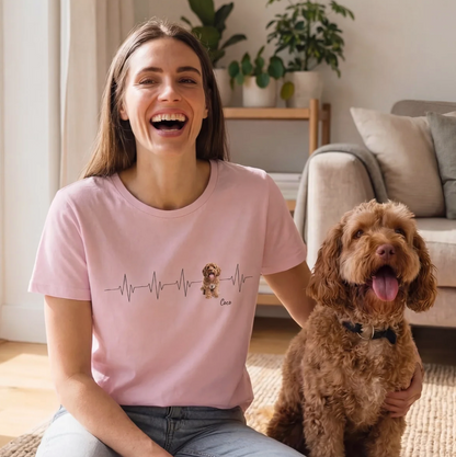 Pink T-shirt with heartbeat design and dog print. Ideal for animal lovers.