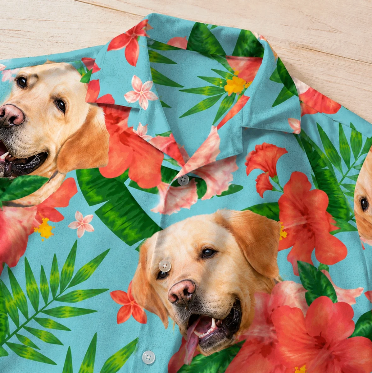 Personalized Hawaiian shirt with dog designs, colourful floral pattern on a turquoise background.