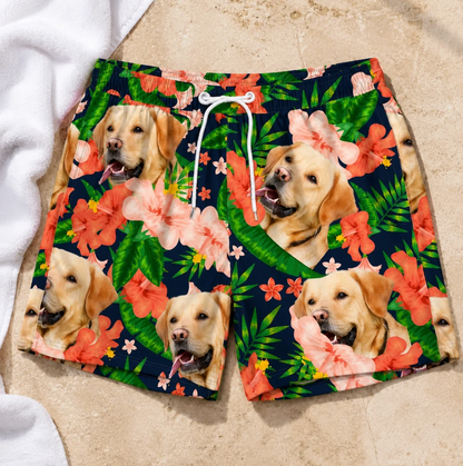 Personalized swim shorts with colourful dog and flower design on a dark background.