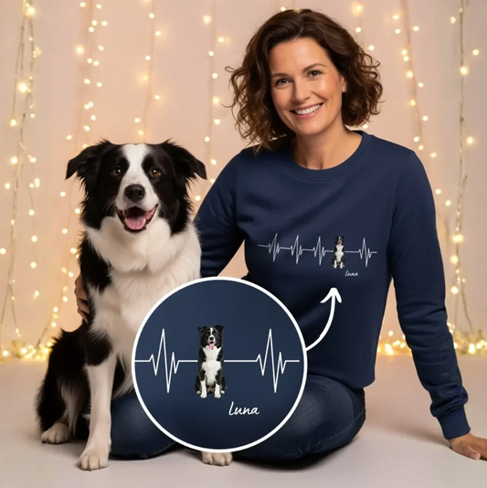 Dark blue personalized sweatshirt with heartbeat design and dog print. Model sitting with a dog.