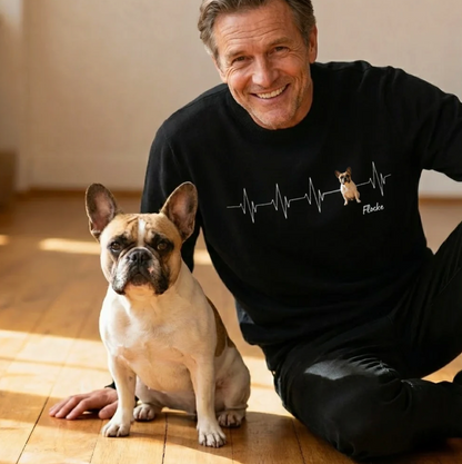 Personalized black sweatshirt with heartbeat design and dog picture. A man sitting next to a dog.