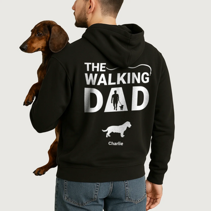 Black hoodie with personalized "The Walking Dad" print and dog designs. Worn by a man with a dog.