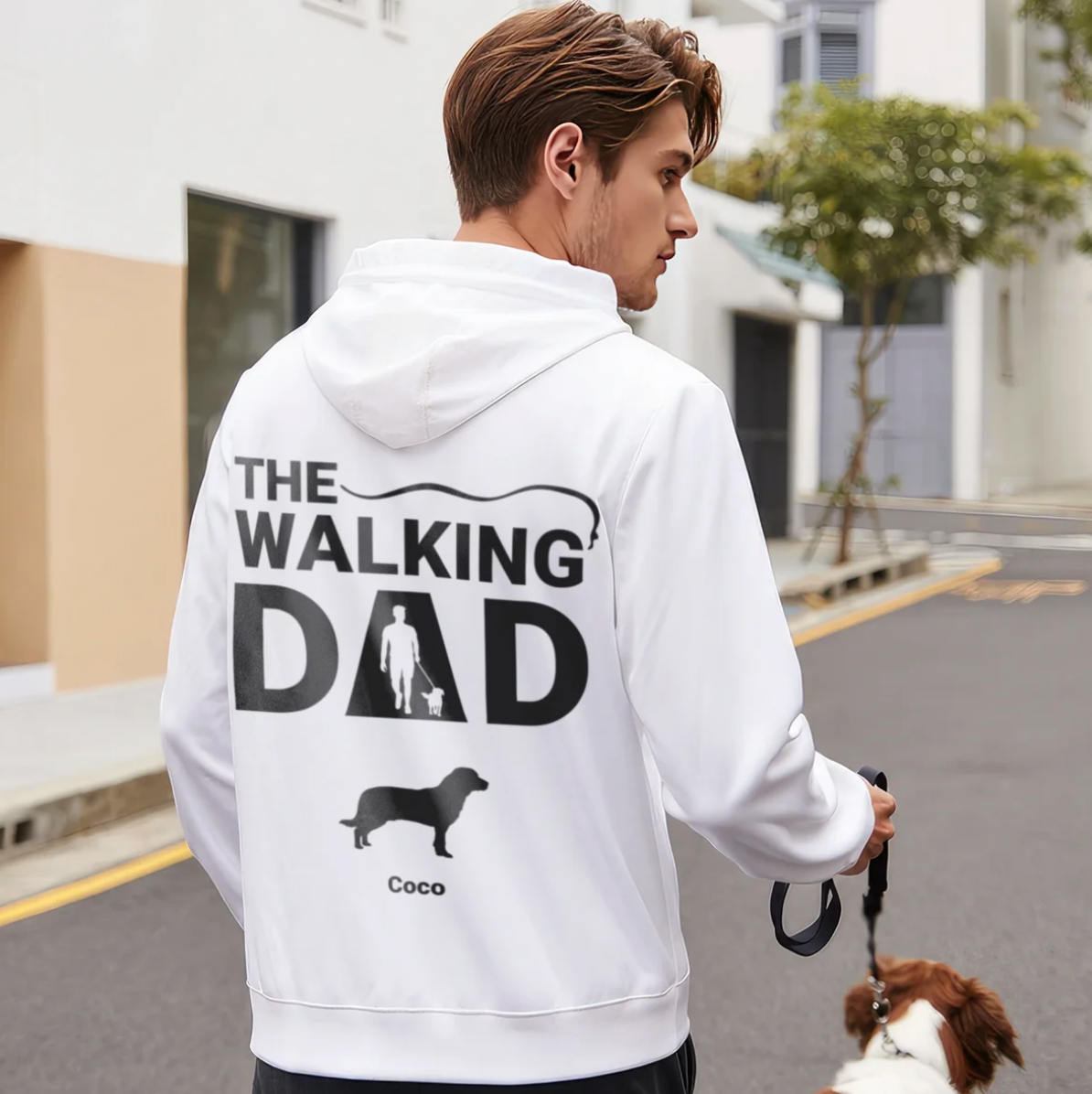 White hoodie printed with "THE WALKING DAD" and a graphic of a dog and a person.