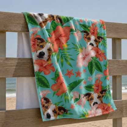 Personalized beach towel with dog motif and colourful flowers on a light blue background.