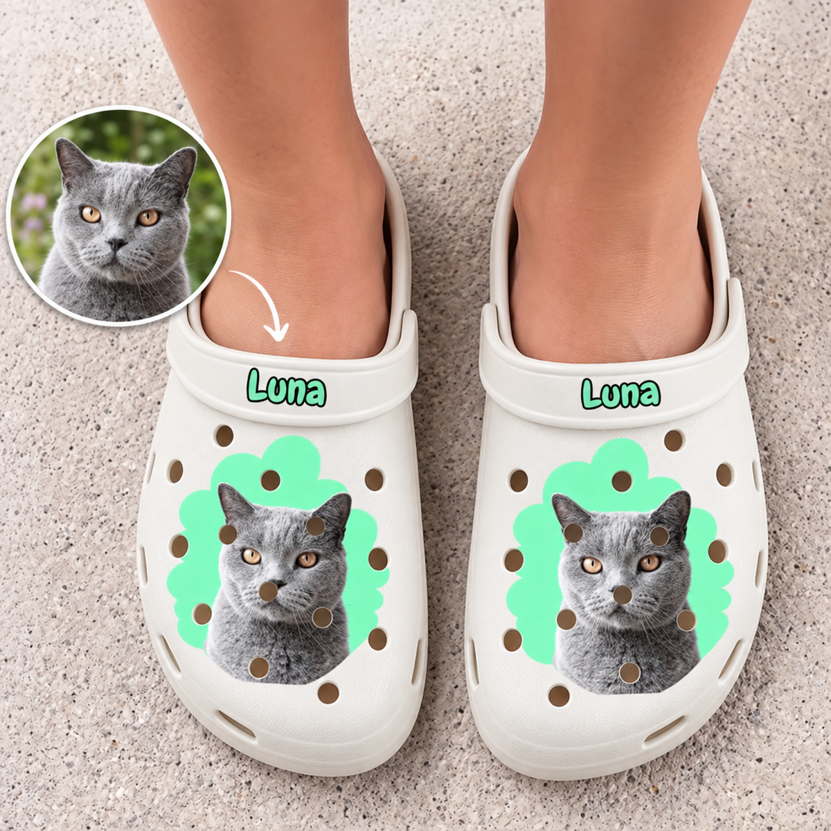 Personalized white clogs with cat and name, green design accents and ventilation holes.