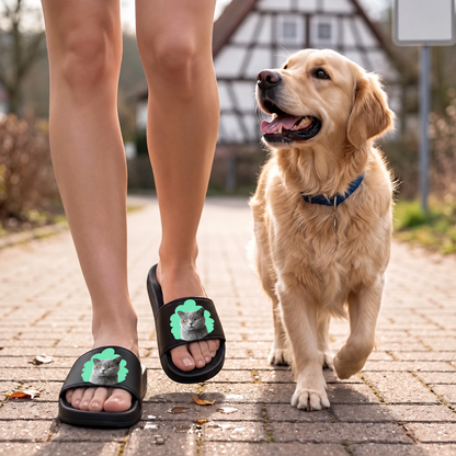 Personalized black slides with cat portrait, worn by a person walking a dog.
