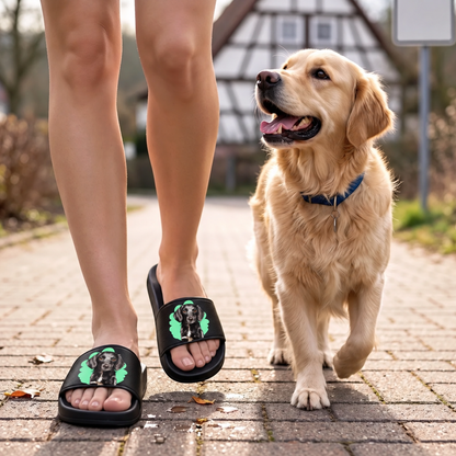 Personalized black slides with pet portrait, worn on a walk with a dog.