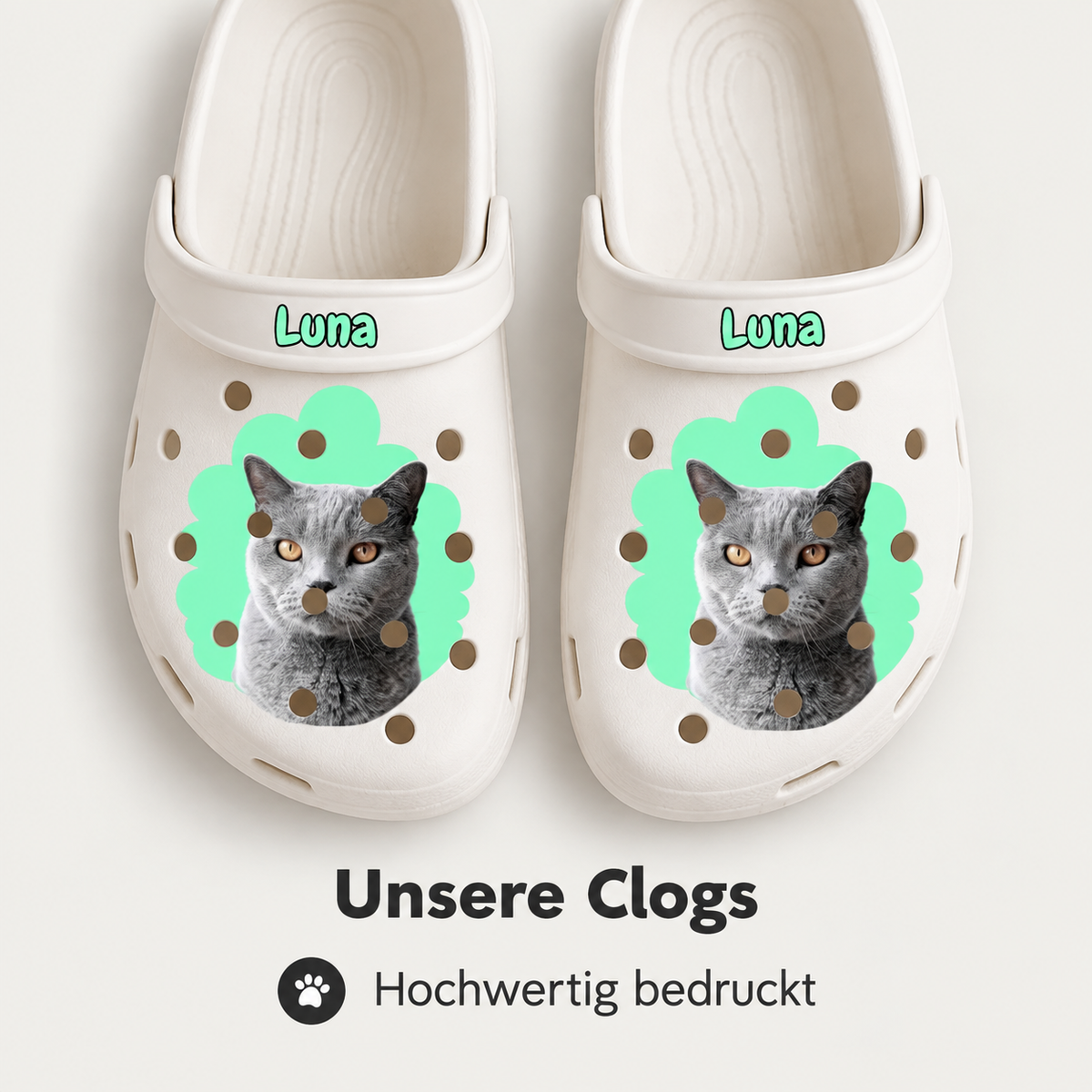 Personalized white clogs with cat portrait and green background graphic. The name "Luna" on top.
