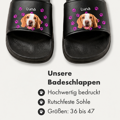 Black slides with a personalized print of a dog's face and paw prints.
