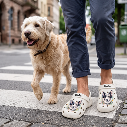 Person wearing personalized clogs with a watercolor dog motif, walking a dog.